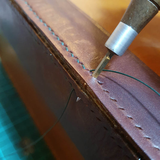 How to use a leather stitching awl